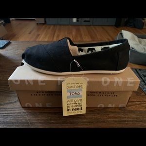 Brand new, never worn Black Toms